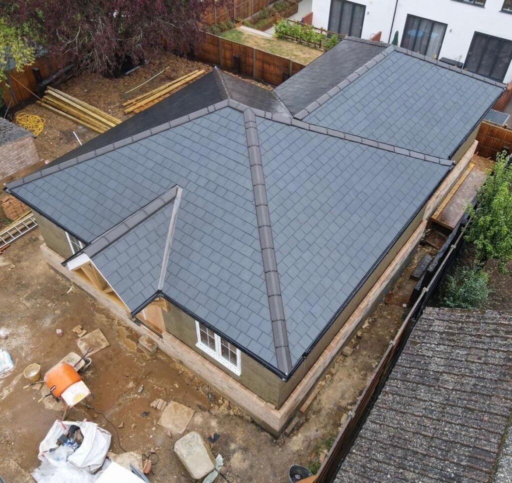 The Infinite Roof Care team working on a roof